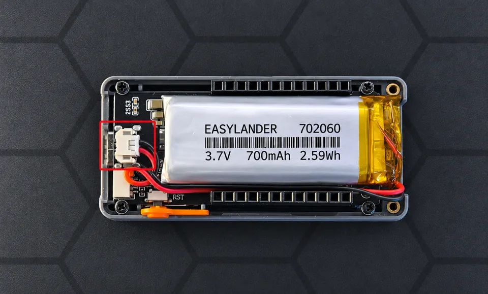 Battery seated in the case and plugged into the board connector